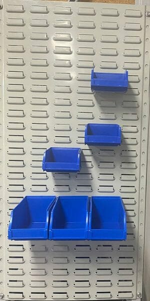 plastic parts bins storage mounted on steel louvre panel